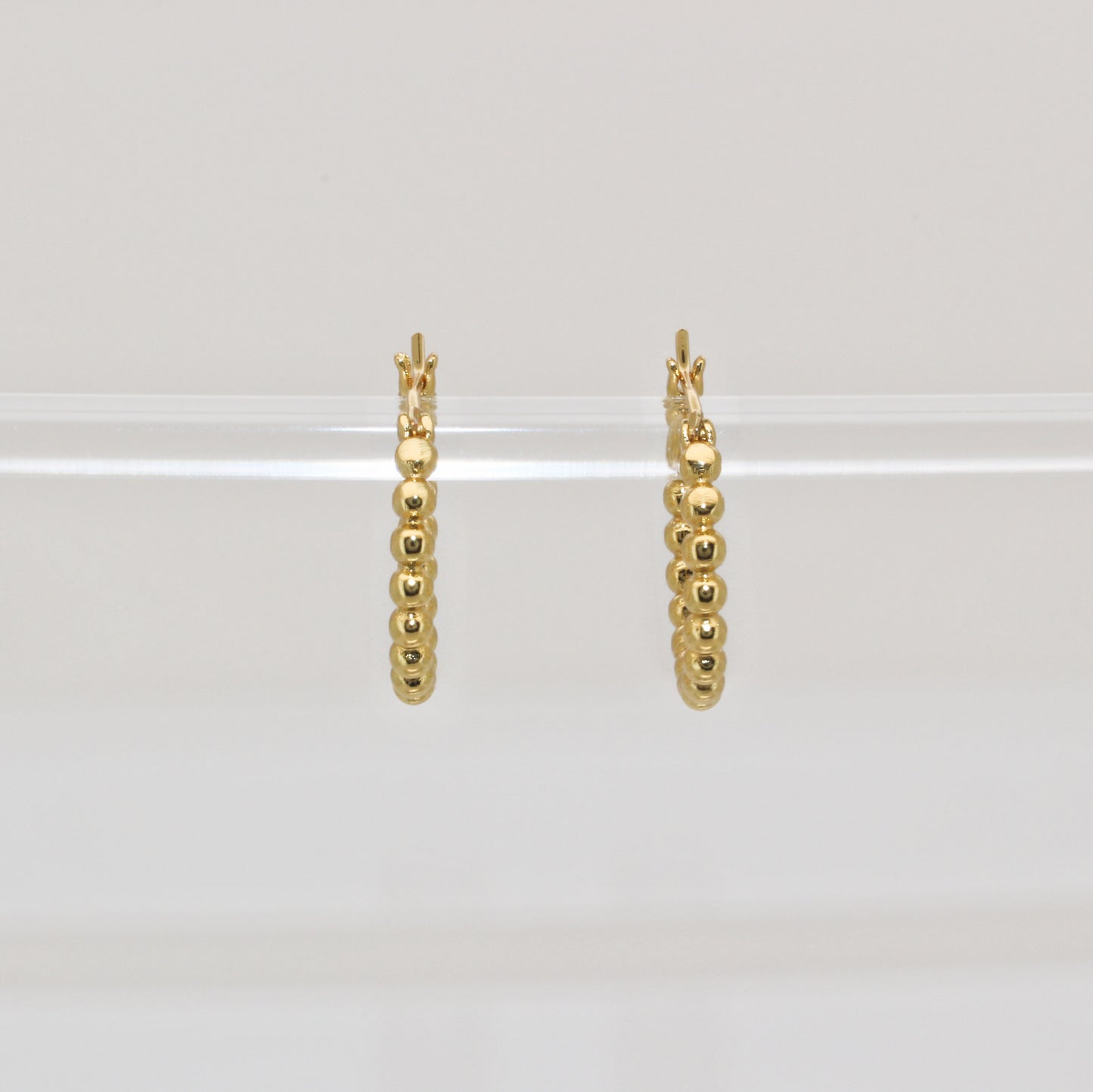 JOY - 14 Karat Gold Earrings · Huggie beaded gold hoop
